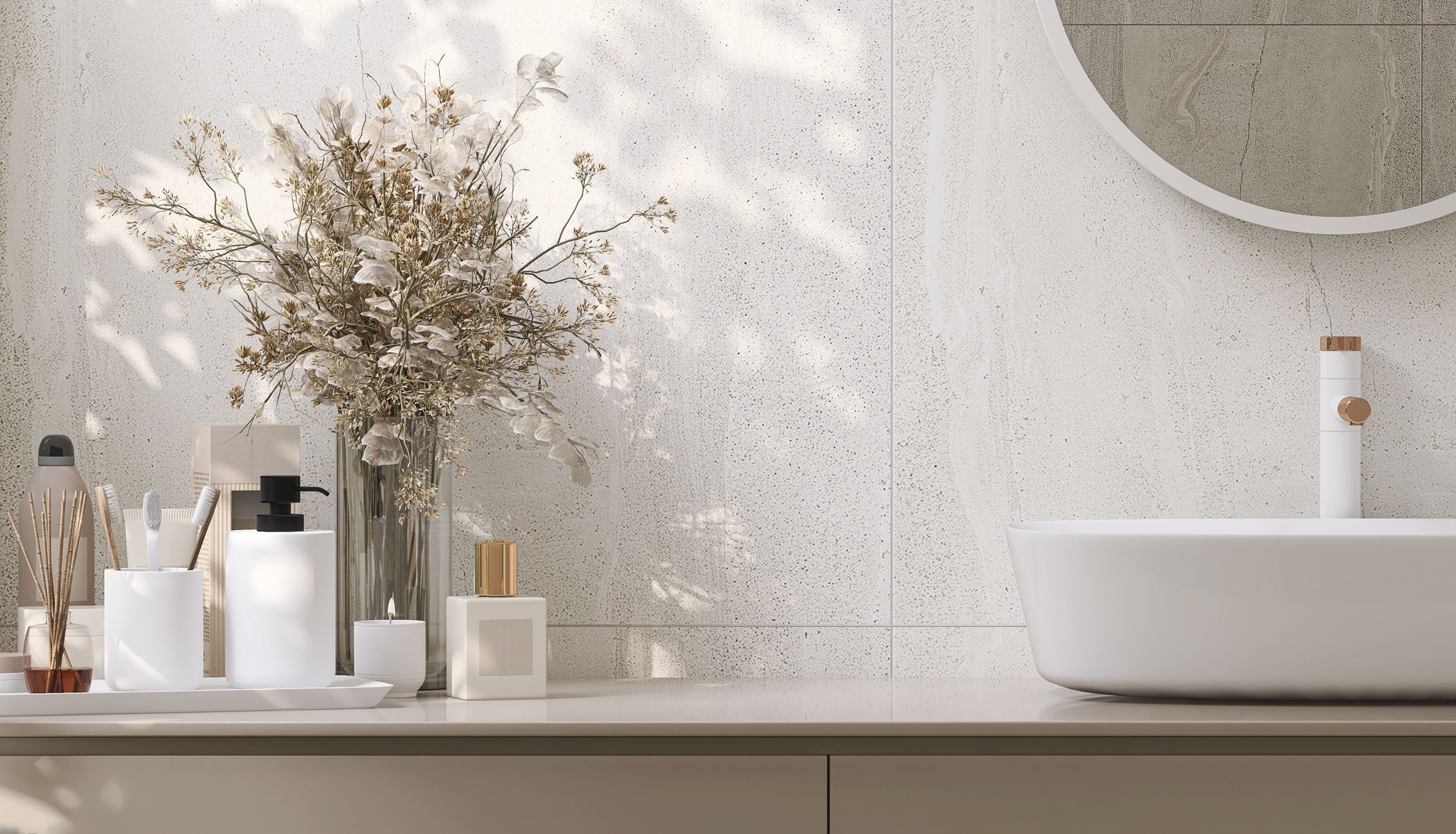 Modern and minimal design of beige colored bathroom vanity and white round ceramic washbasin with vase of houseplant in sunlight from window